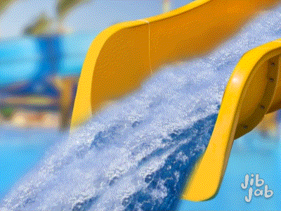 a yellow water slide with jib jab written on it