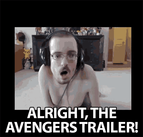 a shirtless man wearing headphones says " alright the avengers trailer ! "