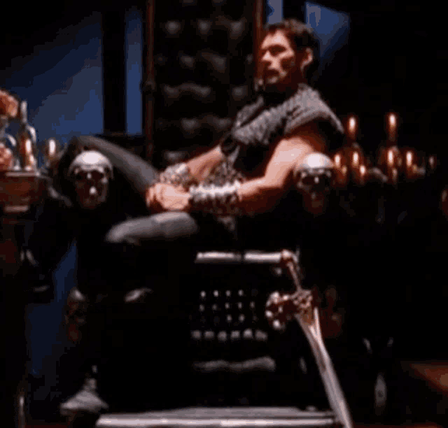 a man is sitting on a throne with a sword