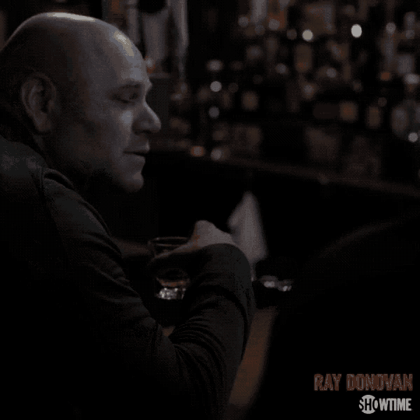 a showtime ad for ray donovan shows a man in a dark room
