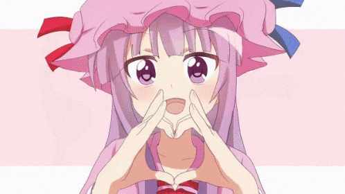 a girl with purple hair and a pink hat making a heart shape with her hands