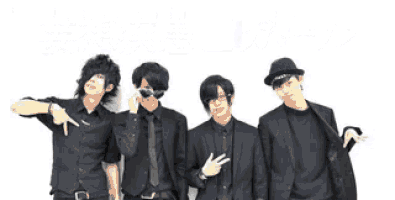 a group of young men are posing for a picture in front of a white wall .