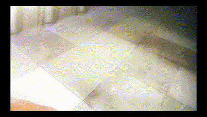 a blurred image of a white couch with a black frame