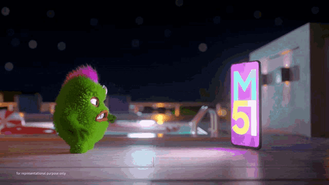 a green monster with a pink mohawk stands next to a cell phone with the number 51 on it