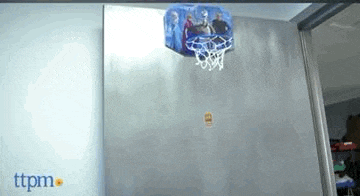 a frozen basketball hoop is hanging on a door in a room .