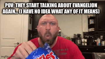a bald man with a beard is eating a bag of ruffles chips