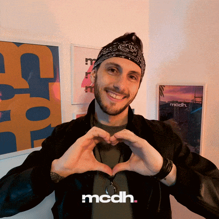a man wearing a bandana making a heart shape with his hands and the word mcdh below him