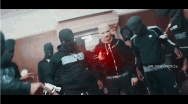 a group of people wearing ski masks and hoodies with the word worldstar hiphop.com on the bottom