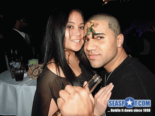 a man and woman pose for a photo with seaspot.com written on the bottom right