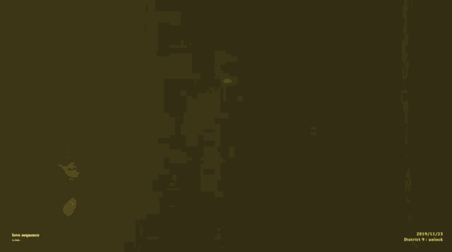 a blurry picture of a person standing in a dark room .
