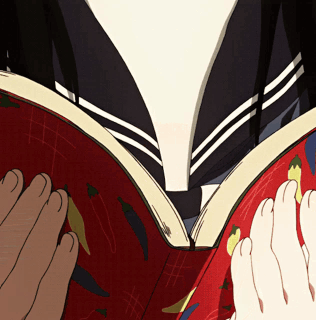 a close up of a person reading a book with vegetables on the cover