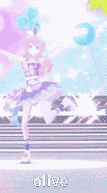 a girl in a blue dress is dancing on a stage with the word olive in the corner