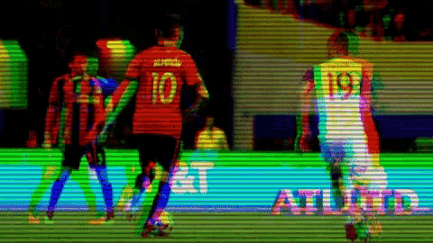 a blurry picture of a soccer game with the word athletic in the corner