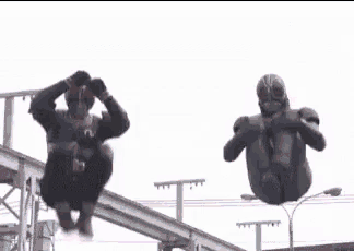 a red superhero is flying through the air with the words tendangan maut written in red