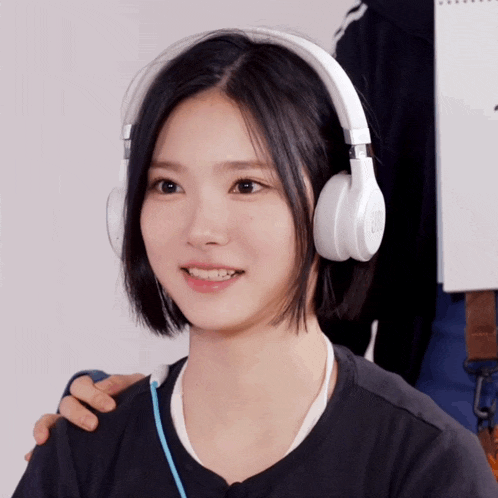 a woman wearing headphones with a blue cord