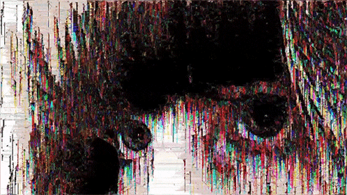 it looks like a painting of a person 's face with a rainbow of colors coming out of it .