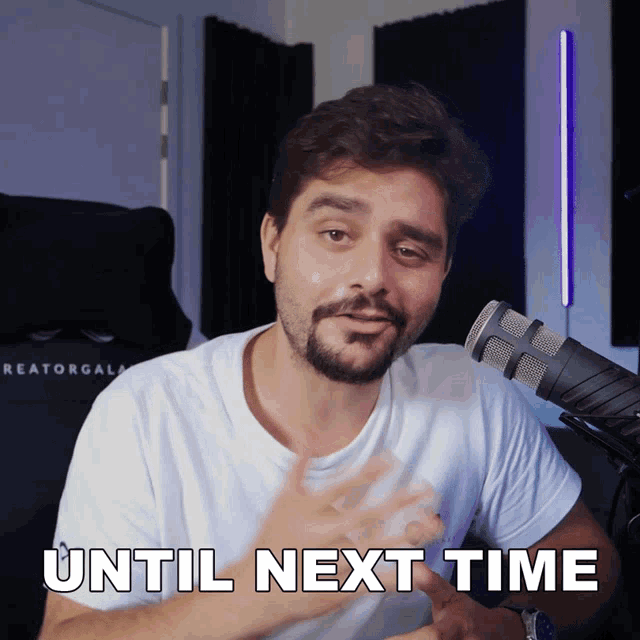 a man in front of a microphone with the words until next time