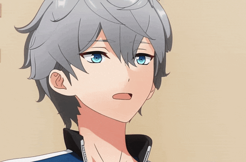 a close up of a person 's face with blue eyes and grey hair