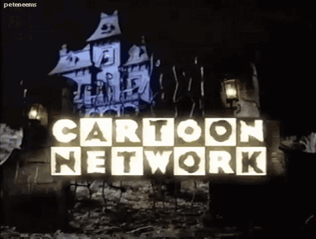 a cartoon network sign with a haunted house behind it