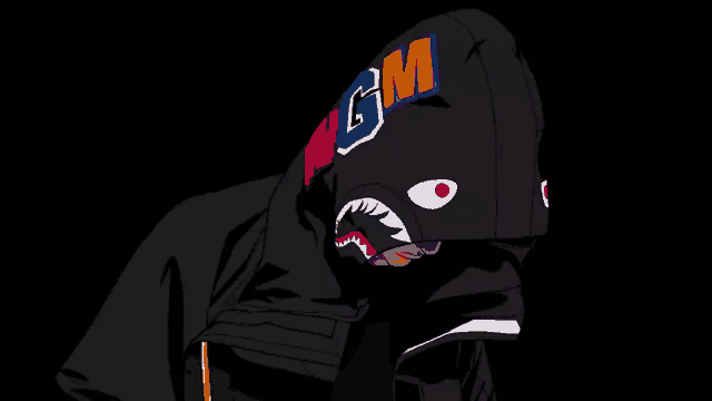 a person wearing a black hoodie with a shark on it