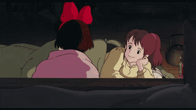 a girl with a red bow on her head is holding a white mug