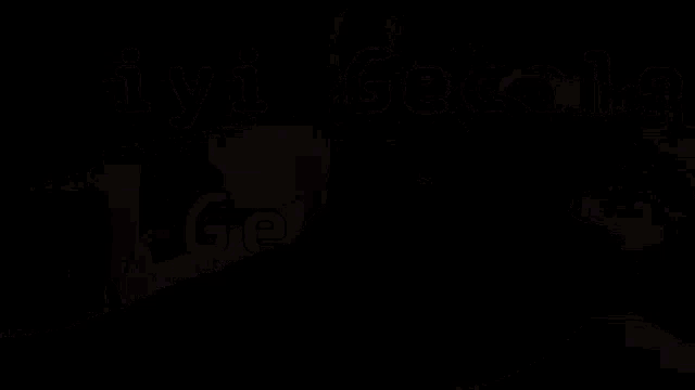 a man is laying on a couch with the words iyi geceler written on the bottom