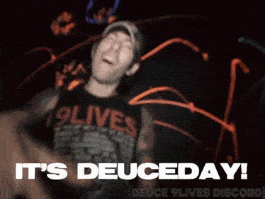 a man in a 19lives shirt says it 's deuceday in a blurry photo