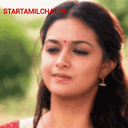 a close up of a woman 's face with the words starttamilchat.in
