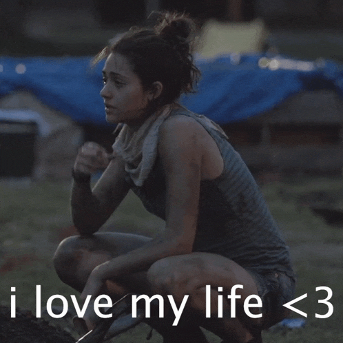 a woman smoking a cigarette with the words i love my life < 3