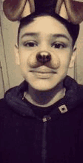 a young boy wearing a dog face mask .