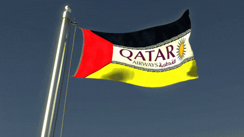 a qatar airways flag is waving in the wind against a blue sky