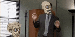 a man in a suit and tie with a skeleton mask on his head