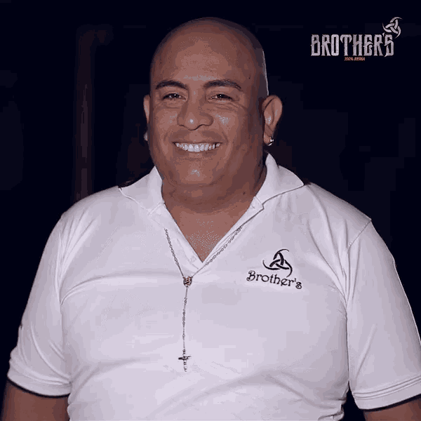 a man wearing a white shirt that says brothers on it