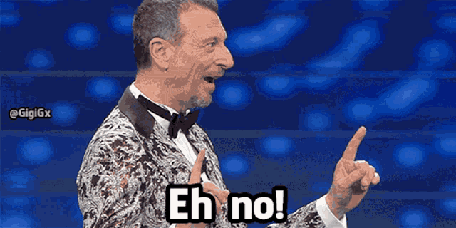 a man in a tuxedo says " eh no " in front of a blue background