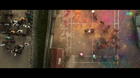 an aerial view of a tennis court with a red container that says fire on it