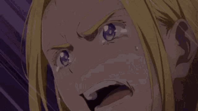 a close up of a person 's mouth with their mouth open and tears coming out of it .