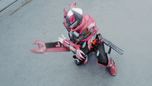 a person in a pink and black costume with a helmet