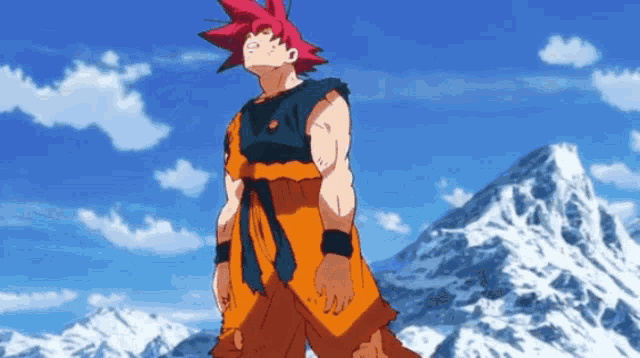 a man with red hair is standing in front of a mountain .
