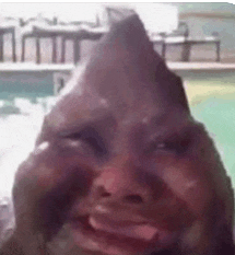 a close up of a person 's face with a triangle shaped nose .
