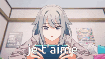 a girl is playing a video game with the words je t'aime written on the screen