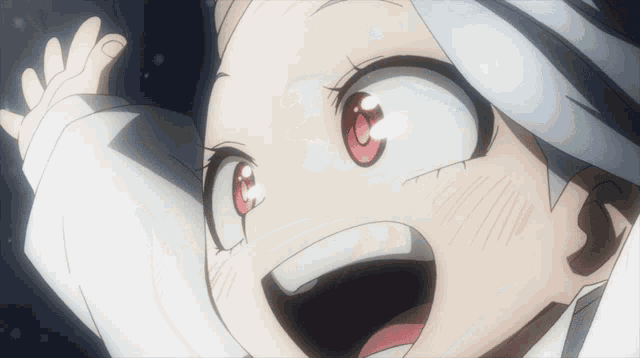 a close up of a person 's face with their mouth open