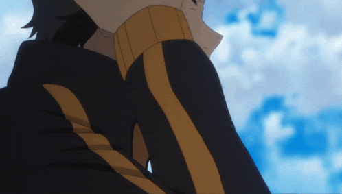 a close up of a person wearing a black and yellow striped shirt