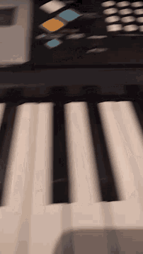 a person is playing an accordion in a close up of the keys .