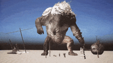 a statue of a monster with chains around its arms