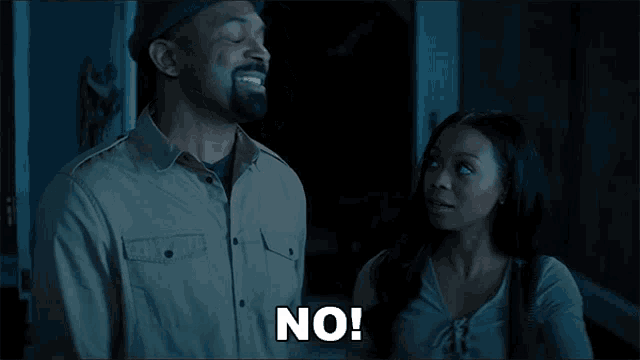 a man and a woman are standing next to each other with the man saying no