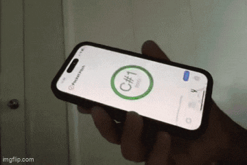 a person is holding a cell phone with a screen that says c # 1 on it