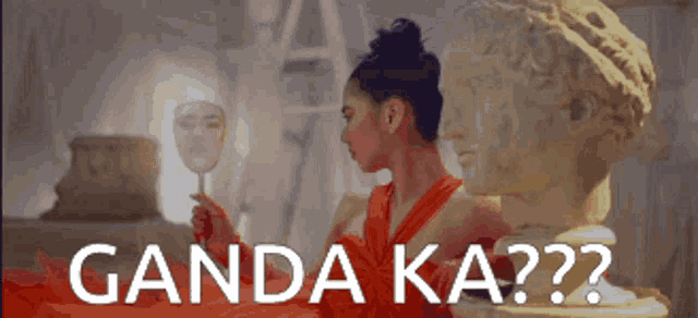 a woman in a red dress is looking at herself in a mirror with the words ganda ka ?? on the bottom