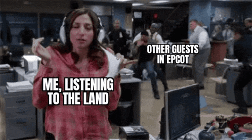 a woman wearing headphones is dancing in an office while other guests in epcot are dancing in the background .