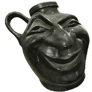 a black vase with a smiley face on it .