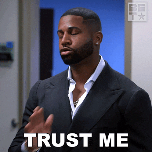 a man in a suit says trust me